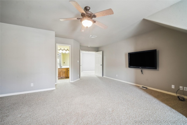 unfurnished living room with carpet, visible vents, baseboards, and ceiling fan