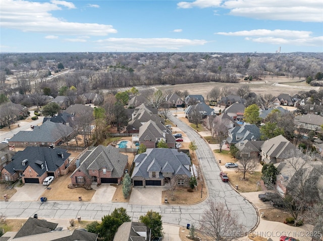 birds eye view of property with a residential view