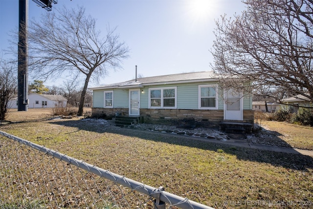 view of front of house featuring crawl space, stone siding, a front yard, and entry steps