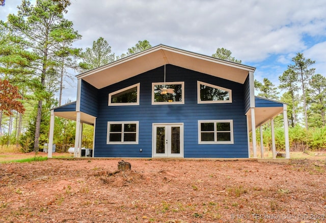 back of property featuring french doors