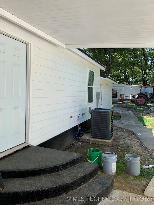 exterior space with central air condition unit