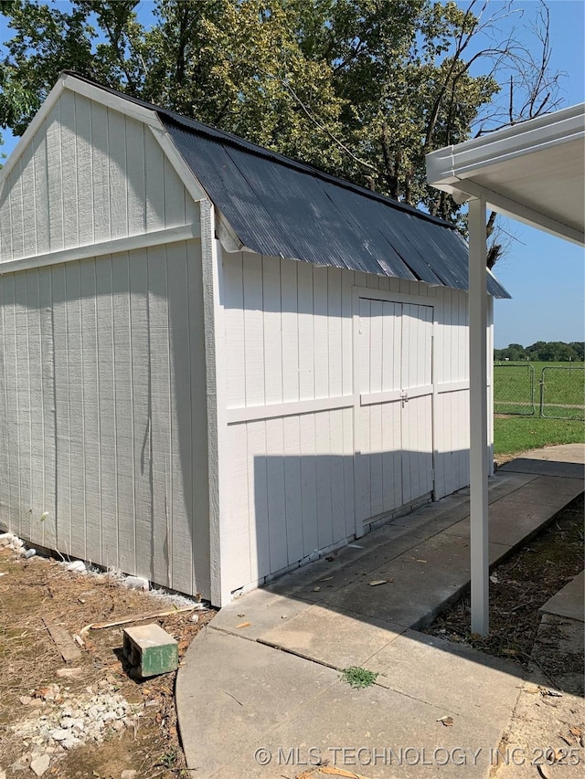 garage featuring a storage unit