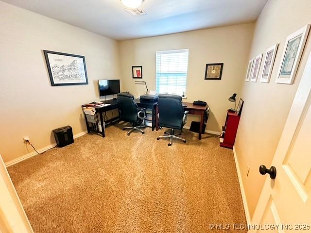 office space with light colored carpet and baseboards