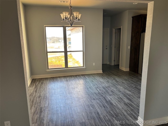 unfurnished dining area with dark wood-style floors, a notable chandelier, visible vents, and baseboards