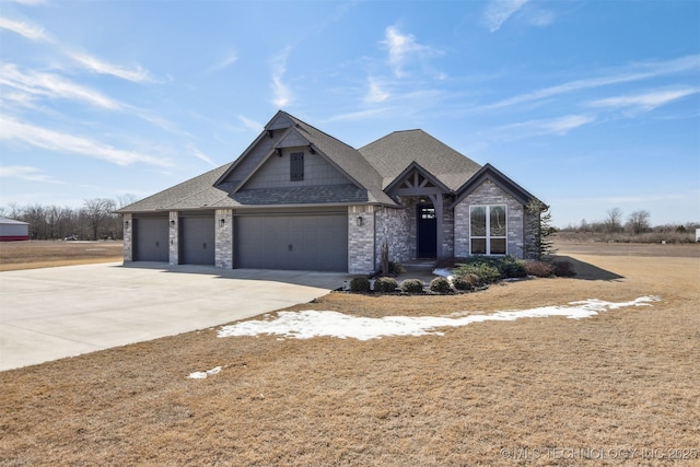 craftsman-style house with concrete driveway, roof with shingles, and an attached garage