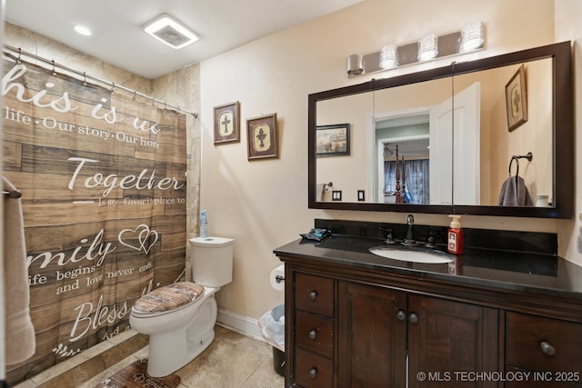 bathroom with toilet, baseboards, visible vents, and vanity