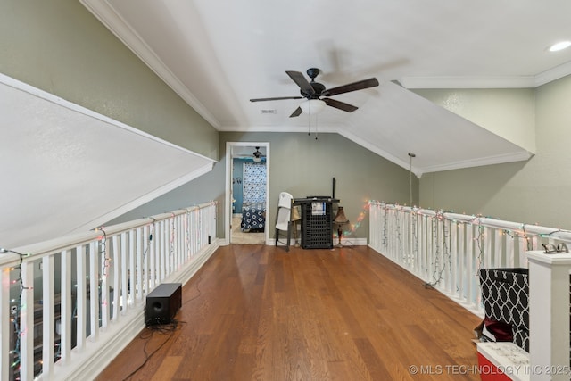 additional living space featuring baseboards, visible vents, lofted ceiling, ceiling fan, and wood finished floors