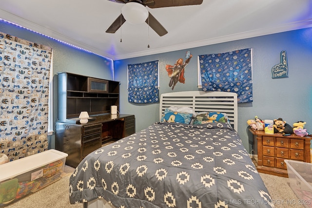 bedroom featuring ceiling fan, a textured wall, and ornamental molding