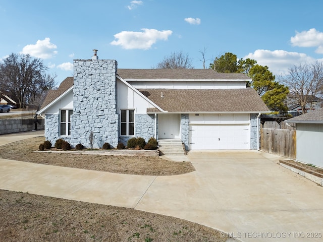 view of front facade featuring driveway, a garage, a shingled roof, stone siding, and fence