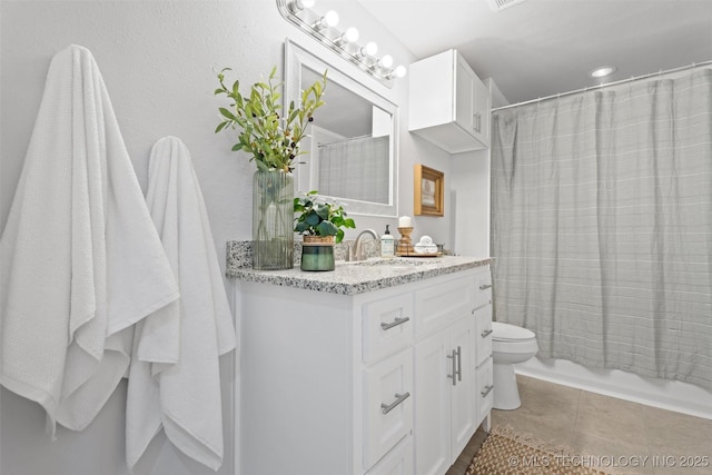 full bath featuring shower / bath combination with curtain, tile patterned flooring, vanity, and toilet