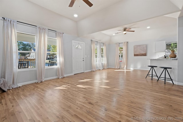 unfurnished living room with ceiling fan, recessed lighting, light wood-style flooring, and baseboards