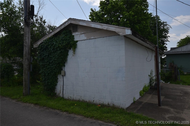 view of home's exterior featuring concrete block siding