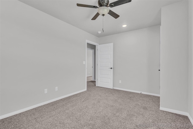 spare room featuring carpet, ceiling fan, baseboards, and recessed lighting