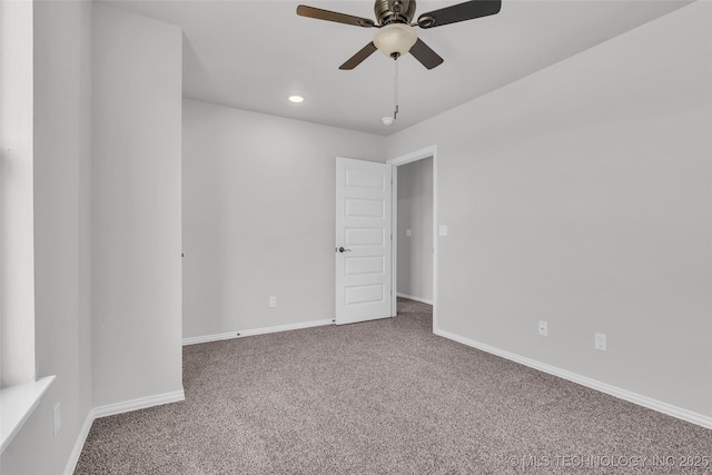 carpeted spare room featuring recessed lighting, ceiling fan, and baseboards