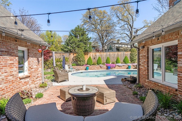 view of patio / terrace with a fenced backyard and a fenced in pool