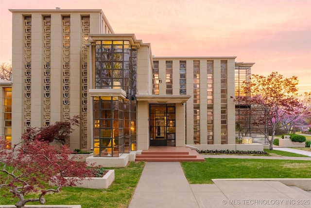 view of property at dusk