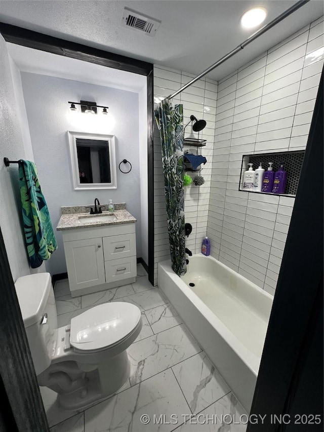 bathroom with visible vents, toilet, marble finish floor, shower / bath combo with shower curtain, and vanity