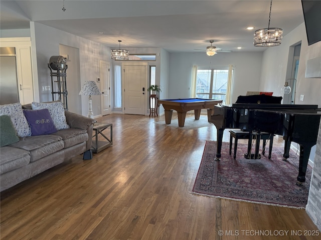 1825 E 45th Pl, Sand Springs, OK 74063 - living room featuring wood finished floors, ceiling fan with notable chandelier, and billiards