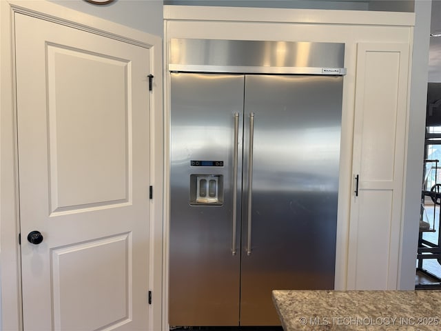 1825 E 45th Pl, Sand Springs, OK 74063 - kitchen with stone countertops and built in fridge