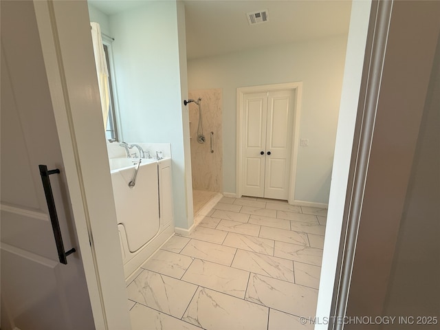 1825 E 45th Pl, Sand Springs, OK 74063 - full bath featuring a stall shower, marble finish floor, baseboards, and visible vents