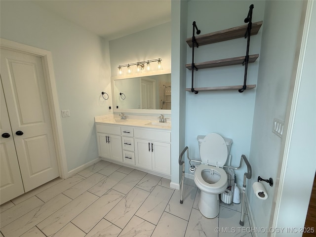 1825 E 45th Pl, Sand Springs, OK 74063 - bathroom with baseboards, marble finish floor, and a sink