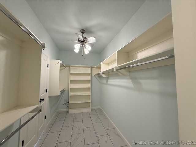 1825 E 45th Pl, Sand Springs, OK 74063 - spacious closet featuring marble finish floor and ceiling fan