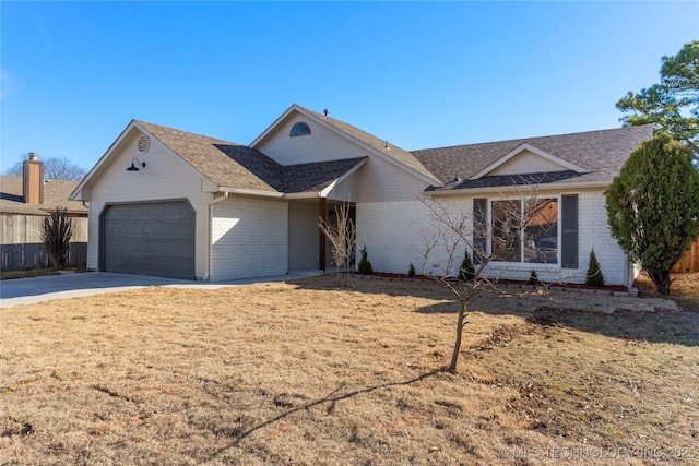 ranch-style home with a garage, concrete driveway, brick siding, and roof with shingles