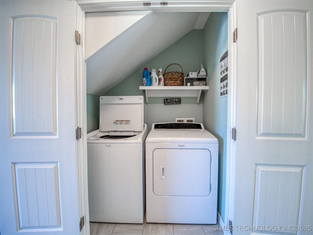 washroom featuring laundry area and washer and clothes dryer