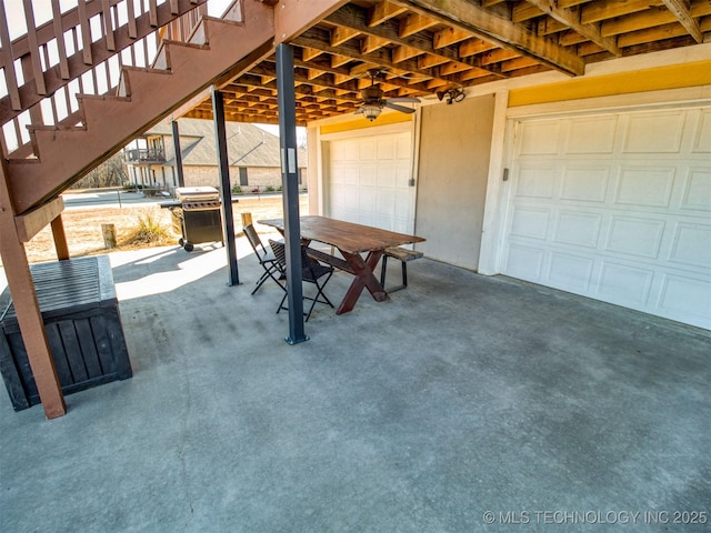 view of patio / terrace featuring stairs, outdoor dining area, and area for grilling