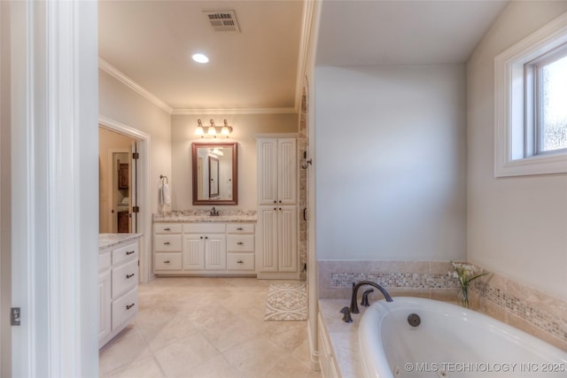 full bath featuring ornamental molding, visible vents, tile patterned flooring, a garden tub, and vanity