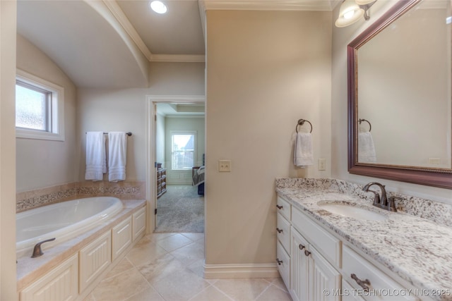 ensuite bathroom featuring vanity, ensuite bath, a wealth of natural light, and crown molding