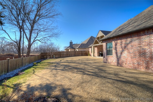 view of yard featuring a fenced backyard