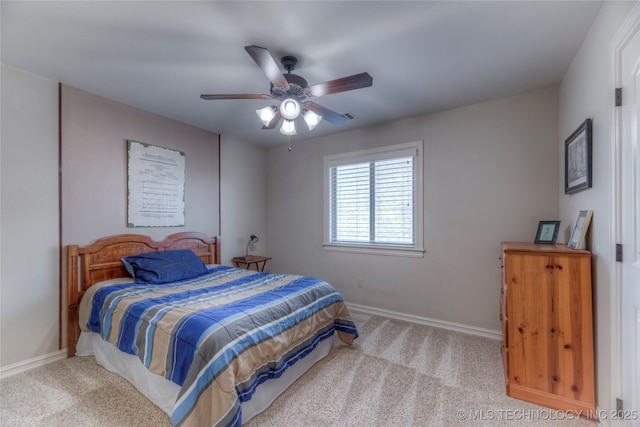 bedroom with light carpet, ceiling fan, and baseboards