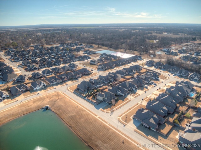 bird's eye view with a water view and a residential view