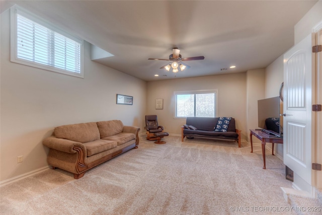 living area with light carpet, recessed lighting, a ceiling fan, and baseboards