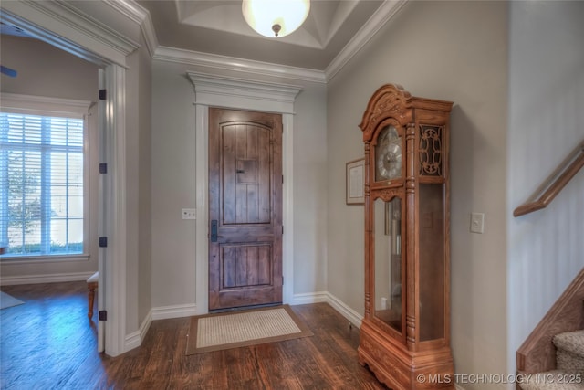 foyer entrance featuring dark wood-style floors, baseboards, stairs, and crown molding