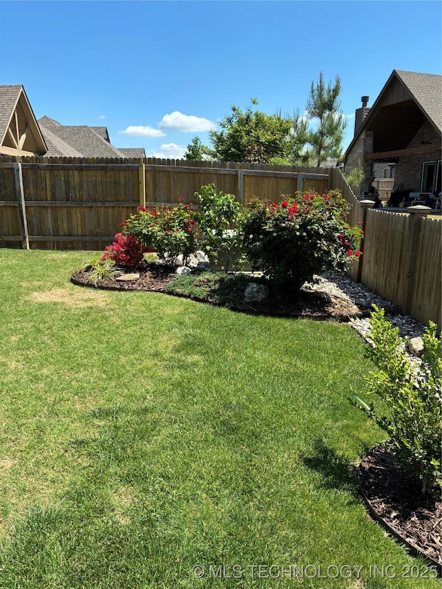 view of yard featuring a fenced backyard