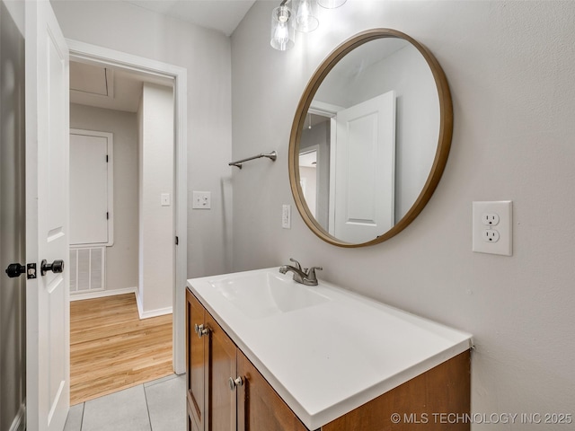 bathroom featuring tile patterned flooring, visible vents, and vanity