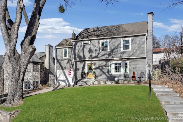 view of front of home with a front lawn and a chimney