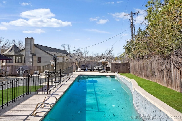 view of pool with a lawn, a patio area, a fenced backyard, and a fenced in pool