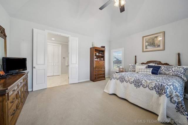 bedroom with a ceiling fan, light carpet, high vaulted ceiling, and baseboards