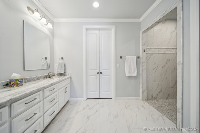 bathroom with marble finish floor, baseboards, ornamental molding, and vanity