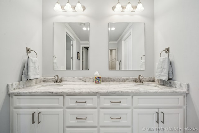 bathroom with double vanity and a sink