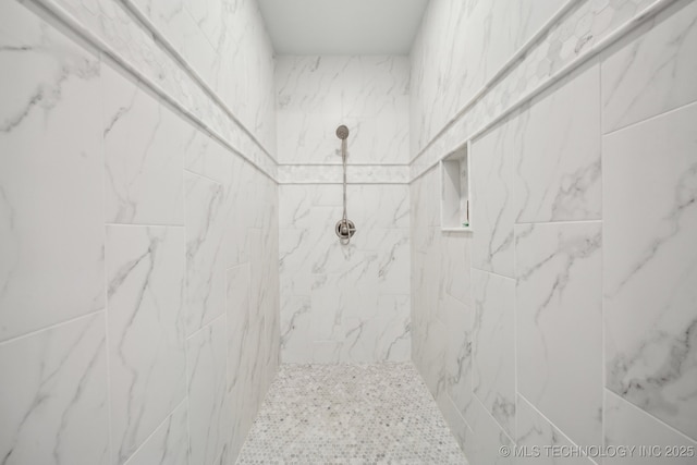 details with a tile shower