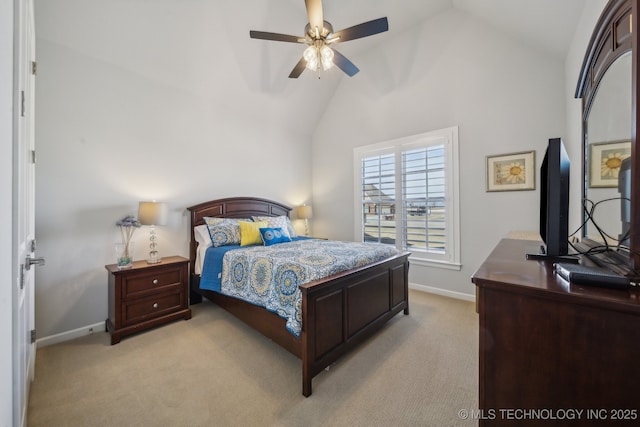 bedroom with light carpet, baseboards, and vaulted ceiling