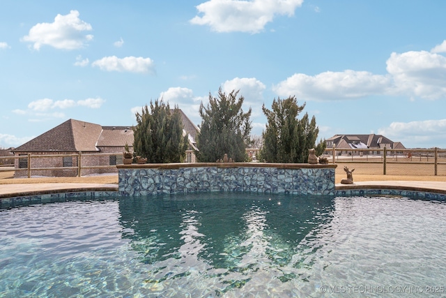 view of pool featuring fence and a fenced in pool