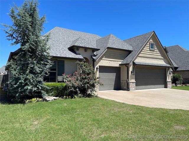 view of front facade featuring a garage, a front yard, concrete driveway, and roof with shingles