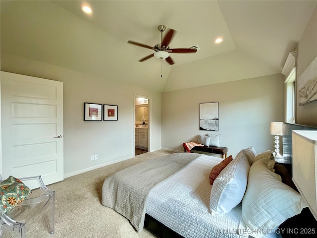 bedroom featuring recessed lighting, light colored carpet, baseboards, vaulted ceiling, and ensuite bath