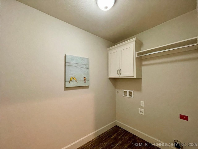 washroom featuring washer hookup, baseboards, cabinet space, dark wood-style floors, and electric dryer hookup