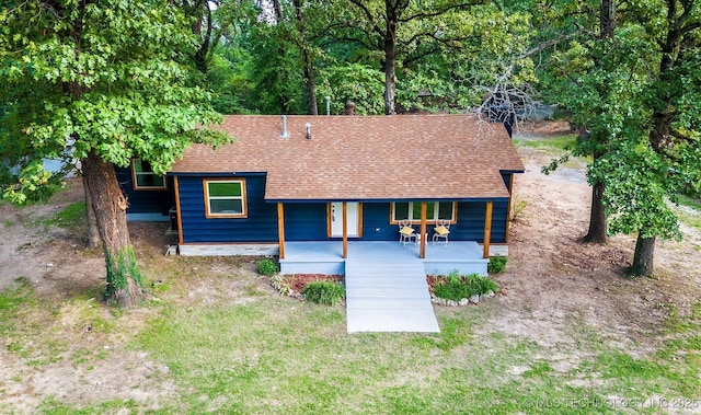 view of front of property with roof with shingles